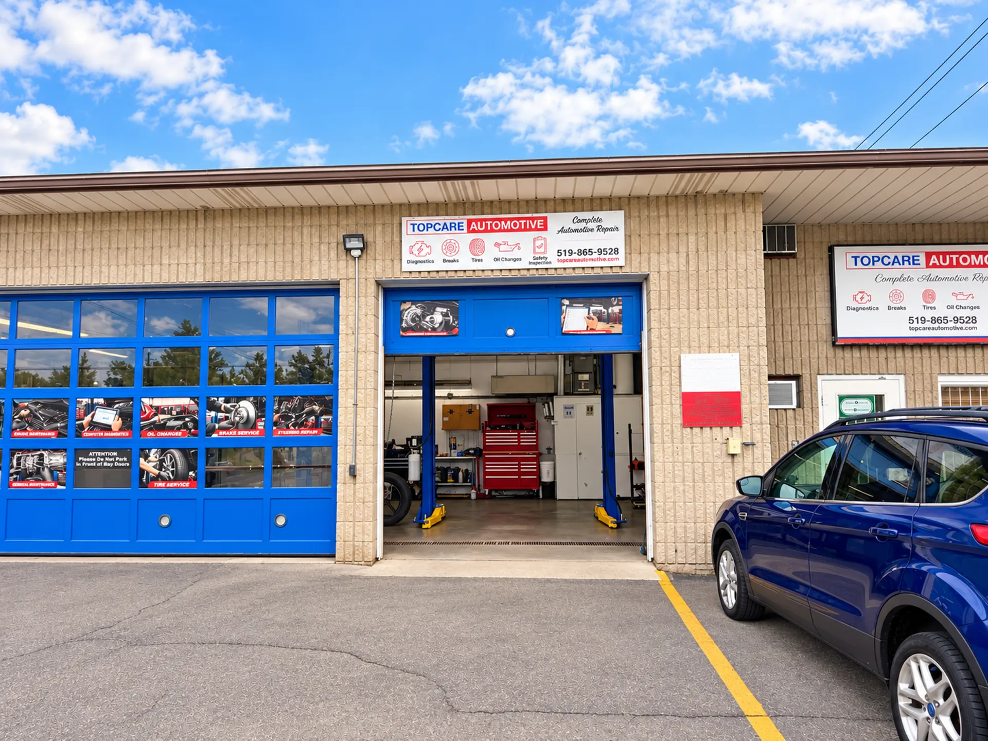 Topcare Automotive garage at 291 Rawdon Street, Brantford, with blue bay doors and an open service bay